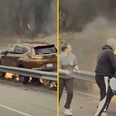 Hero bystanders rush across road to rescue man from burning vehicle